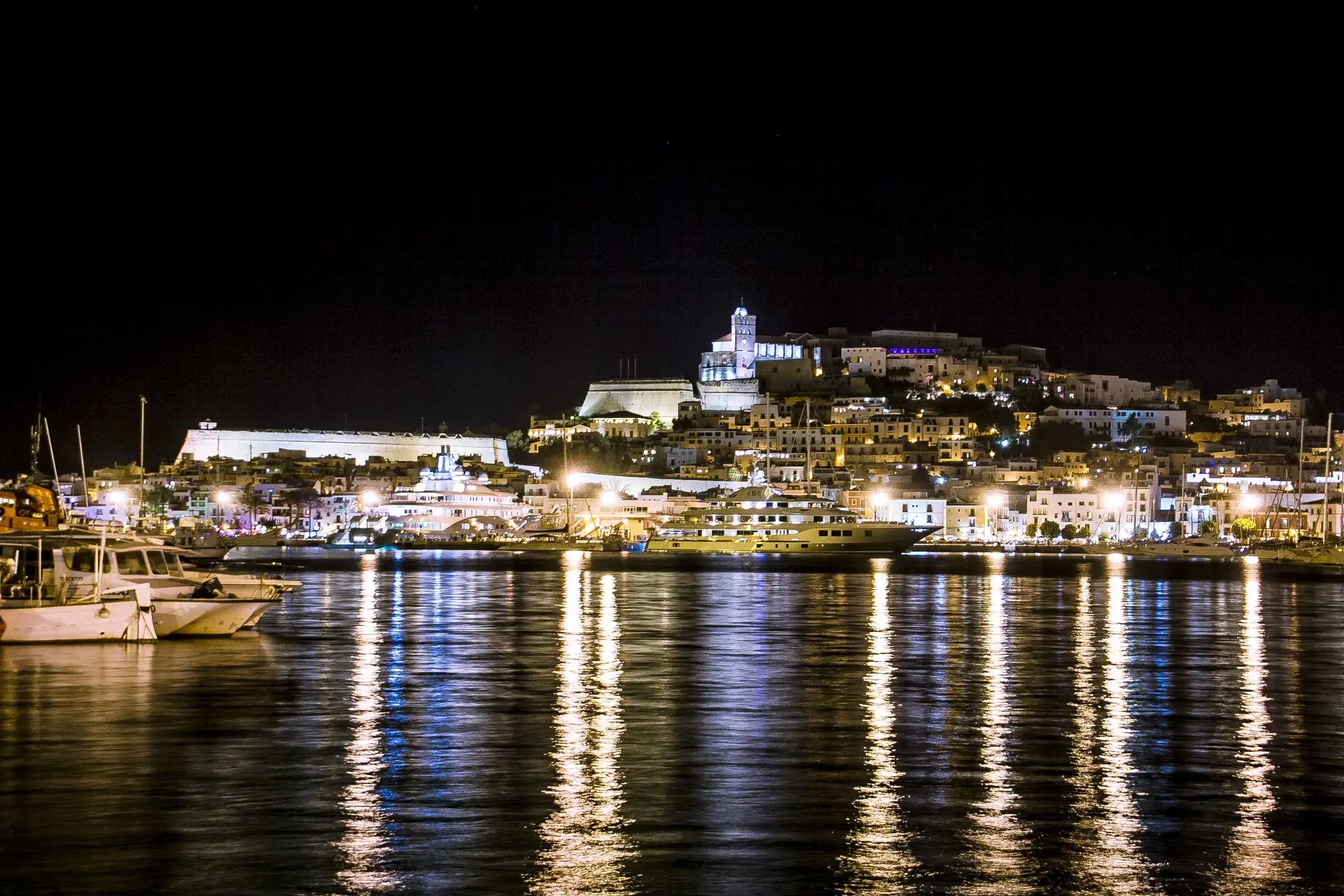Dalt Vila at night, Ibiza's old town lights up above the harbor